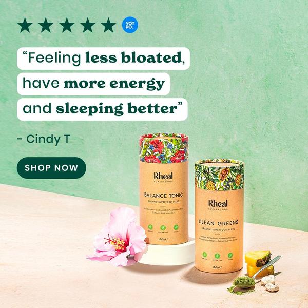 A square-ratio ad creative featuring two superfood blend products with a customer testimonial and five-star rating, using a clean, soft-green background.